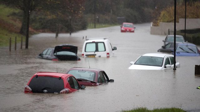 Cars submerged in a flood in Bristol, UK