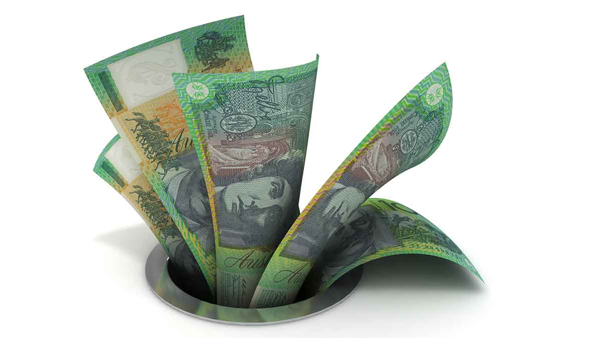 Cash down a drain. Pic: Getty