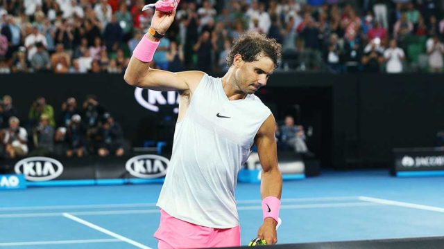 Rafael Nadal throws his headband in frustration after pulling out of the Australian Open. Pic: Getty