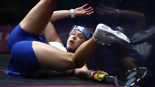 Lisa Aitken crashes into the wall during her women's double match with team mate Alison Thomson of Scotland on day 7 of the Gold Coast Commonwealth Games.