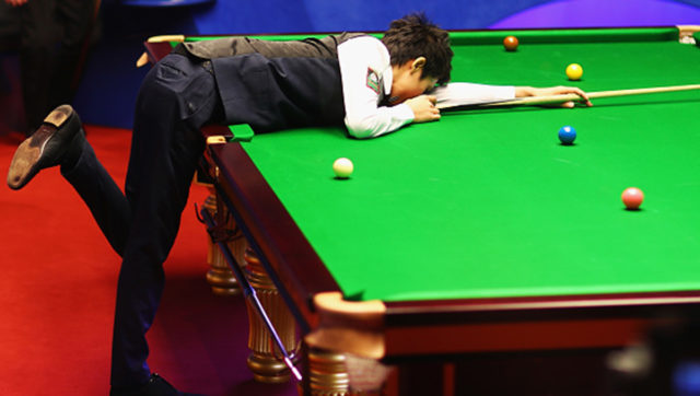 Thepchaiya Un-Nooh of Thailand reacts during his first round match during day five of the World Snooker Championships.