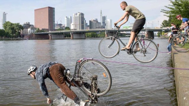 Bicyclists ride into the river in a campaign for bicycle safety this week in Frankfurt, Germany. Pic: Getty