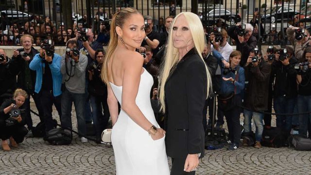 Jennifer Lopez and Donatella Versace at Paris fashion week's Versace show in 2014. Pic: Getty