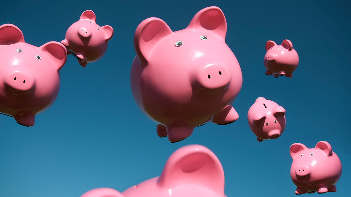 Money, flying piggy banks, Getty