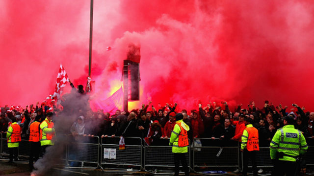 Liverpool fans light flares outside the stadium prior to the UEFA Champions League Semi Final First Leg match between Liverpool and A.S. Roma.