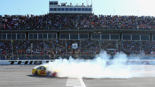 Joey Logano, driver of the #22 Shell Pennzoil/Autotrader Ford, celebrates with a burnout after winning the Monster Energy NASCAR Cup Series at Talladaga Superspeedway.