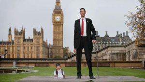 The shortest man ever, Chandra Bahadur Dangi meets the worlds tallest man, Sultan Kosen in 2014 in London, England. Pic: Getty