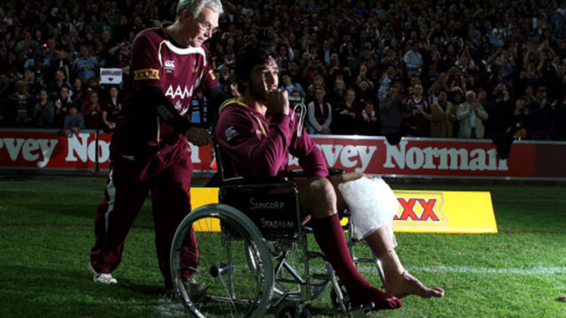 Johnathan Thurston holds onto a green whistle after injury in the State of Origin in 2011.