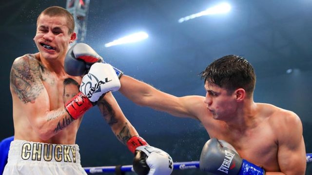 Daniel Roman lands a punch against Moises Flores in the WBA Super Bantamweight Championship in Texas. Pic: Getty