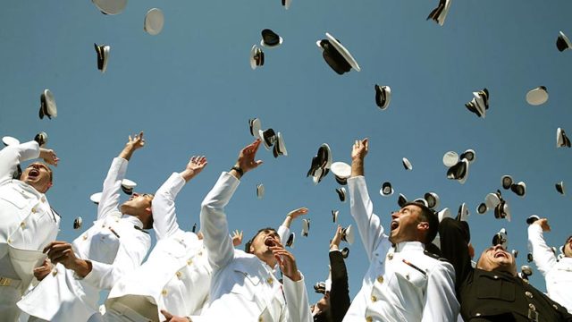Graduates toss their hats in the air at the US Naval Academy in Maryland, US, May 2015. Pic: Getty