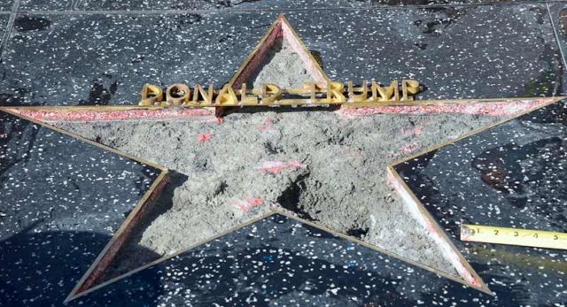 The remains of President Trump's star on the Hollywood Walk of Fame after it was smashed by a protestor last night. Pic: Getty
