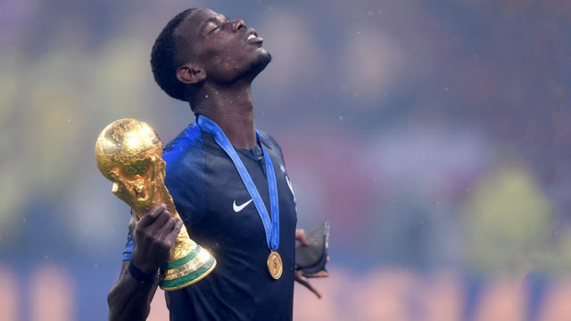 French superstar footballer Paul Pogba celebrates with the World Cup trophy after his team won the FIFA World Cup in Russia early today. Pic: Getty