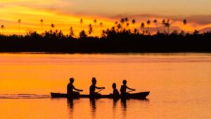 A family canoes on the Langa Langa Lagoon, on the West coast of Malaita Island in the Solomon Islands. Pic: Getty