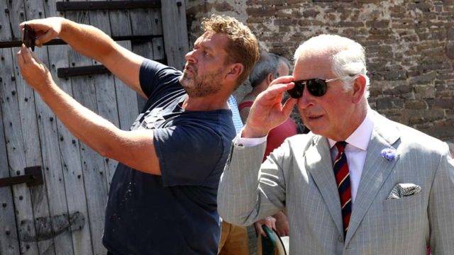 A Royals fan takes a selfie with Price Charles on a visit to Wales earlier today. Pic: Getty