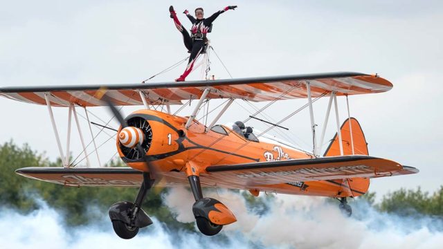 A "wingwalker" performs at an air show in Bromley, England last week. Pic: Getty