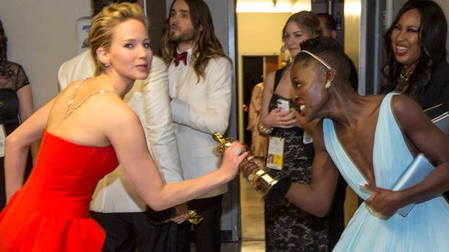 Jennifer Lawrence, left, Lupita Nyong'o backstage at the 2014 Oscars. Pic: Getty