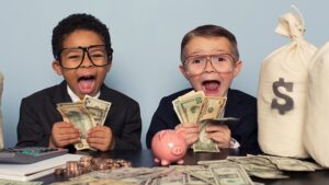 Two boys celebrating with lots of money. Pic: Getty