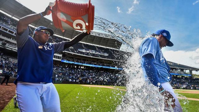 Meibrys Viloria of the Kansas City Royals is doused with water by Salvador Perez as they celebrate winning. Pic: Ed Zurga/Getty Images