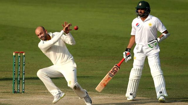 Aussie Nathan Lyon takes a catch from his own bowling to dismiss Fakhar Zaman of Pakistan in the 2nd Test in Abu Dhabi on Wednesday. Pic: Getty
