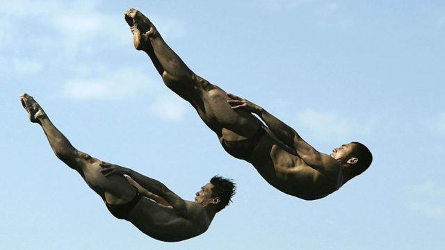 Chinese divers Tianling Wang and Feng Wang at the 2003 World Swimming Championships in Barcelona, Spain. Pic: Getty