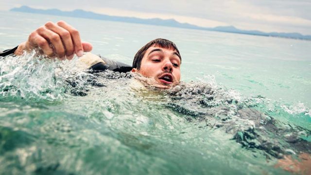 Struggling to stay afloat while swimming and drowning. Pic: Getty