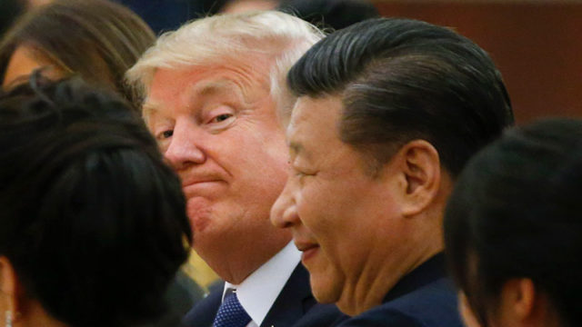 President Trump and China's President Xi Jinping in Beijing last year. Pic: Getty
