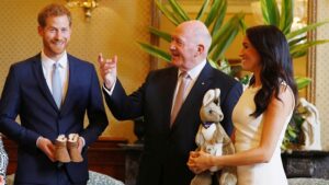 Prince Harry and a pregnant Meghan with GG Peter Cosgrove in Sydney today. Pic: Getty