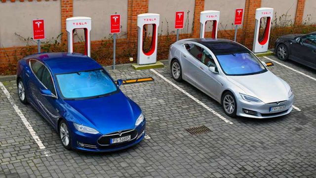 Tesla Model S vehicles on a electric charging point. Source: Getty.