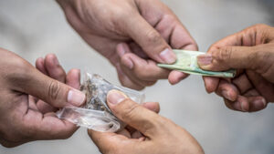 Drug deal: Handing over money for cannabis or marijuana. Pic: Getty