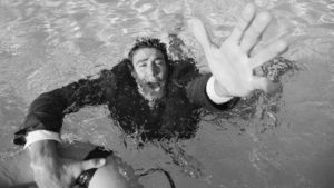 A businessman drowning underwater. Pic: Getty