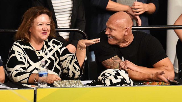 Australia's richest woman hobnobs with swimming great Michael Klim. Pic: Getty