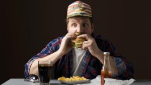 man eating burger