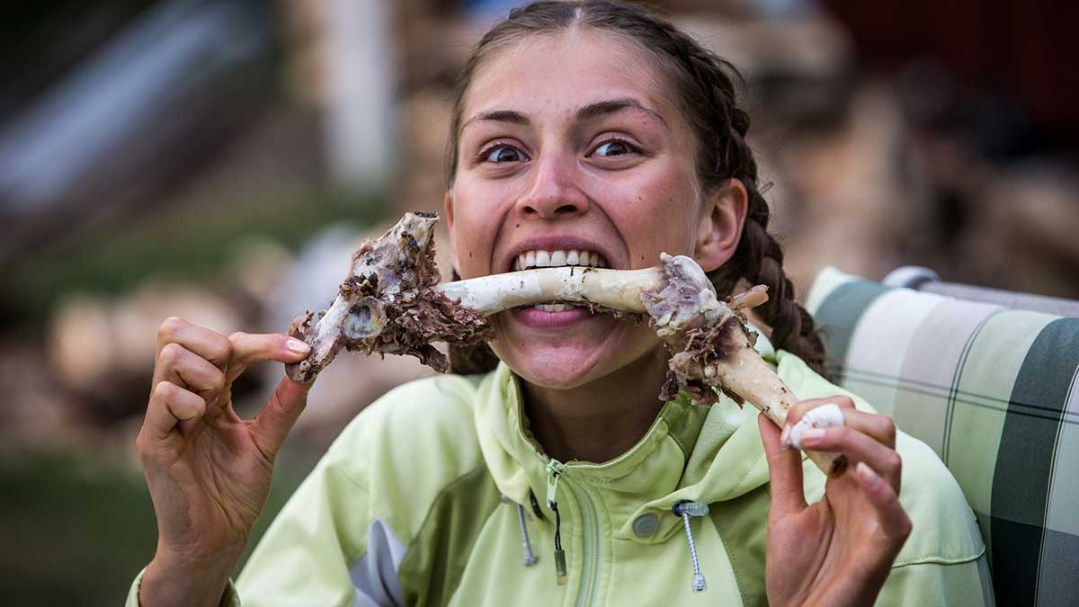 girl-eating-meat-off-bone