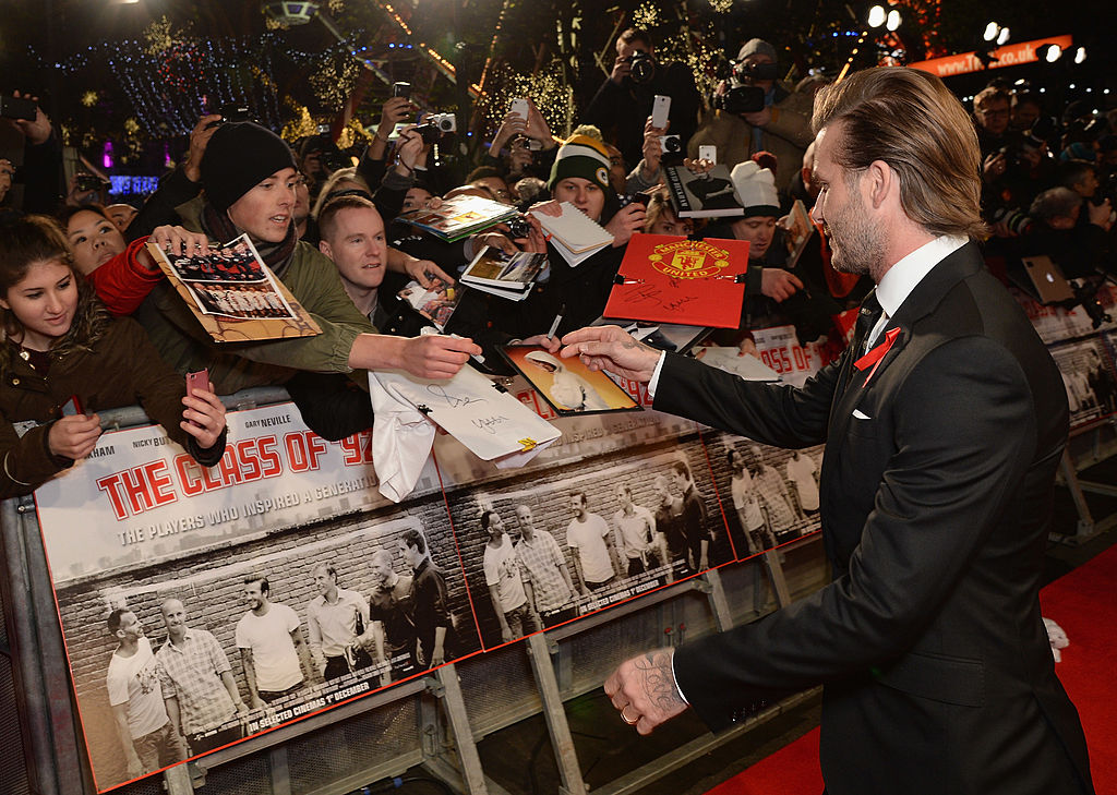 Class of 92 David Beckham greets the crowd at the premiere